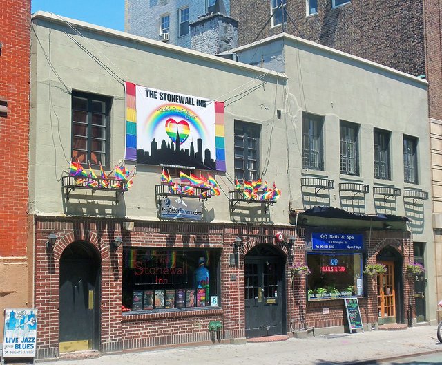 Stonewall Inn, birthplace of the modern gay-rights movement, festooned with gay-pride banners and flags the weekend after Gay Pride Day